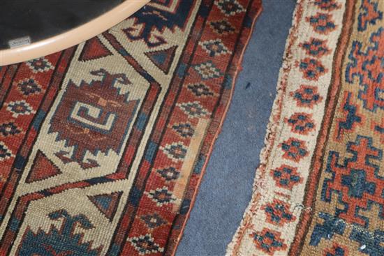 A Bokhara burgundy ground carpet 287 x 172cm